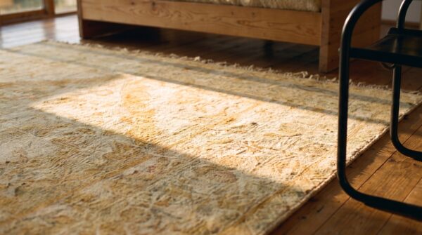 Light warm washed out color antique indian room size amritsar rug 8 Light warm washed out color antique indian room size amritsar rug (sku 20762) - in-room detail
