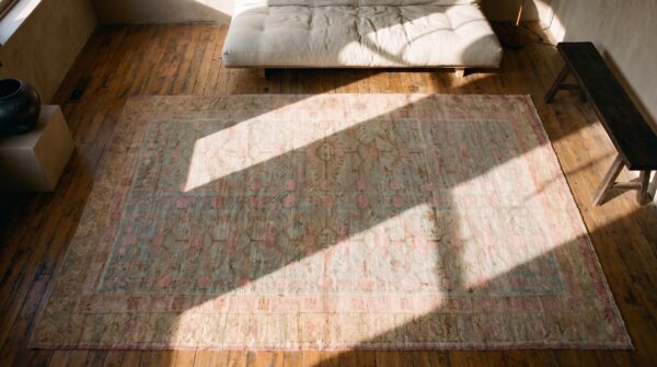Light washed out color antique east turkestan pomegranate design khotan rug (sku 20051) - styled overhead view