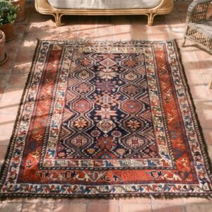 Antique Luri Persian Knotted Rug (SKU 21292) - styled overhead view