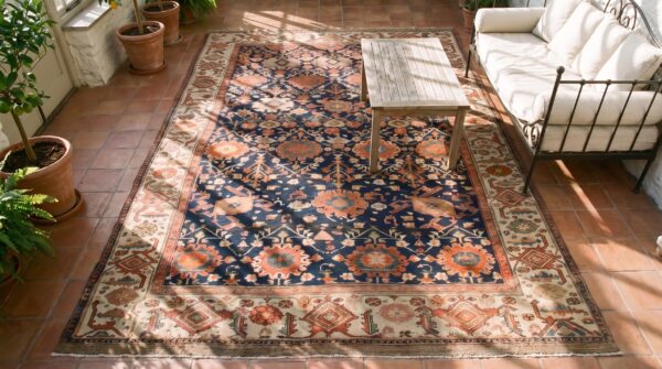 Magnificent large scale allover tribal design antique rustic persian bibikabad room size rug 2 Magnificent large scale allover tribal design antique rustic persian bibikabad room size rug (sku 25467) - styled overhead view