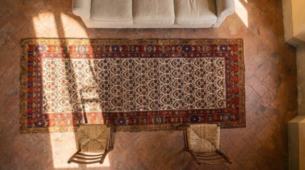 Mid 19th century persian kurdish carpet 3'6"×10'6" hand-knotted wool (sku 19284) - styled overhead view