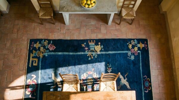 Minimalist open solid blue color field antique chinese art deco scatter size rug (sku 23558) - styled overhead view