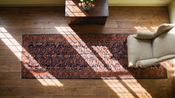 Antique n. W. Persian geometric knotted hallway runner rug (sku 24527) - styled overhead view