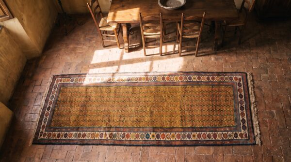 Antique n. W. Persian hallway runner wool yellow rug 2 Antique n. W. Persian hallway runner wool yellow rug (sku 21106) - styled overhead view