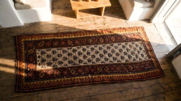 Antique n. W. Persian ivory 1870s hallway runner rug 2 Antique n. W. Persian ivory 1870s hallway runner rug (sku 22115) - styled overhead view