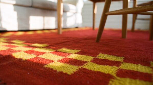 Antique navajo - rio grande small scatter size wool red rug 11 Antique navajo - rio grande small scatter size wool red rug (sku 25543) - in-room detail