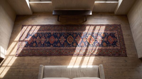 Antique northwest persian hallway runner rug (sku 25254) - styled overhead view