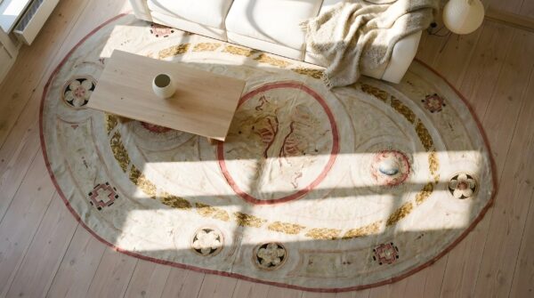 Oval wool floral medallion antique ivory beige cream white 1880s hand knotted pile rug 2 Oval wool floral medallion antique ivory beige cream white 1880s hand knotted pile rug (sku 24775) - styled overhead view