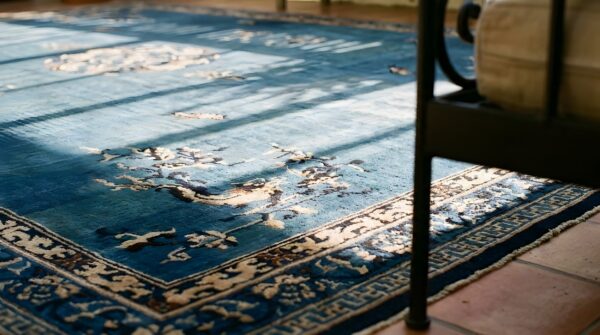 Antique oversized blue color chinese medallion pattern knotted pile rug (sku 23642) - in-room detail