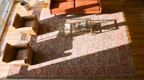 Antique oversized lahore indian geometric knotted rug (sku 24850) - styled overhead view