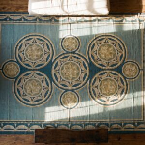 Antique Oversized Needlepoint Portugal Flat Weave Rug (SKU 17482) - styled overhead view