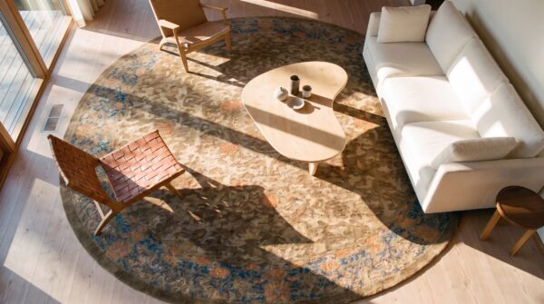 Antique peking oval room size wool mocha rug (sku 24107) - styled overhead view