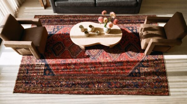 Antique persian baluch geometric coral small scatter size tribal rug 2 Antique persian baluch geometric coral small scatter size tribal rug (sku 20912) - styled overhead view