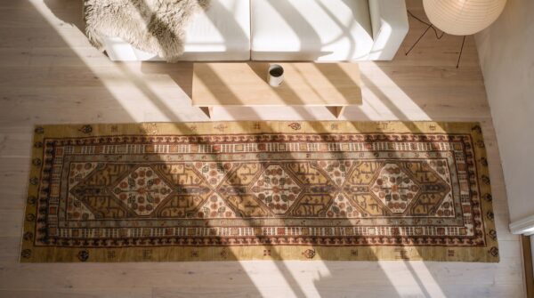 Antique persian serab hallway runner rug - late 19th century tribal brown earth tone (sku 23326) - styled overhead view