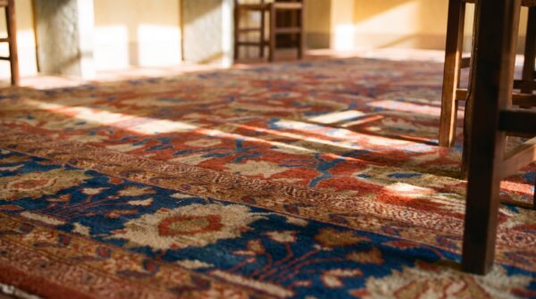 Antique persian sultanabad rug 12'6"×14' coral red & blue, 1880s 12 Antique persian sultanabad rug 12'6"×14' coral red & blue, 1880s (sku 19801) - in-room detail