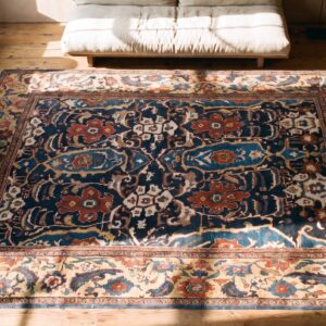 Primitive Tribal Design Antique Blue Room Size Persian Sultanabad Rug (SKU 21242) - styled overhead view