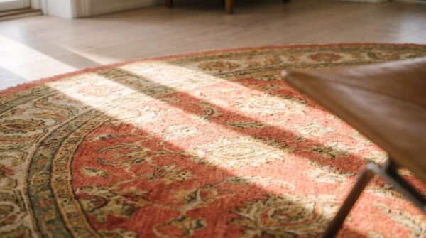 Rare large round coral antique irish donegal arts & crafts rug 15 Rare large round coral antique irish donegal arts & crafts rug (sku 19313) - in-room detail