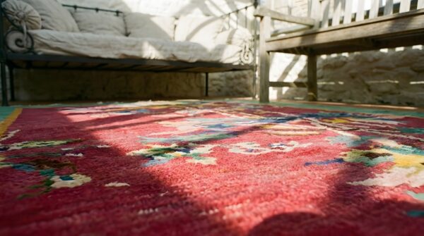 Rectangle hand knotted pile 1920s antique wool red rug (sku 25153) - in-room detail