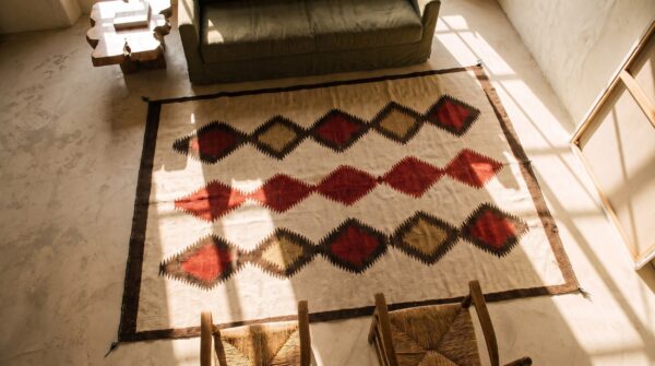 Rectangle ivory beige cream white allover geometric 1930s wool flat weave antique rug 2 Rectangle ivory beige cream white allover geometric 1930s wool flat weave antique rug (sku 20332) - styled overhead view