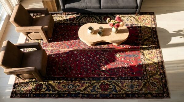 Red artistic floral tree of life design small antique persian bakhtiari rug 2 Red artistic floral tree of life design small antique persian bakhtiari rug (sku 24270) - styled overhead view
