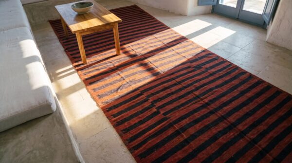 Red background blue striped antique oversized flat woven indian dhurrie rug 2 Red background blue striped antique oversized flat woven indian dhurrie rug (sku 24148) - styled overhead view