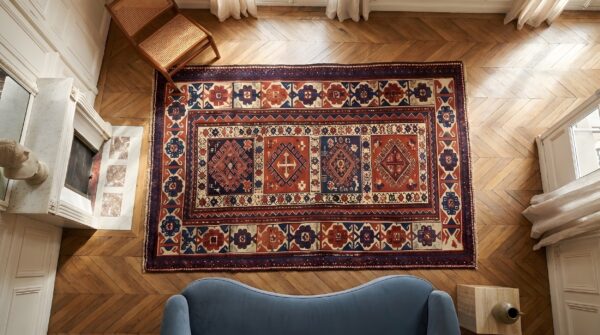 Red antique caucasian allover tribal geometric wool hand knotted pile 19th century rug (sku 22195) - styled overhead view