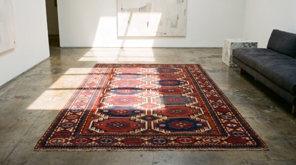 Antique red caucasian moghan tribal rug 6 Antique red caucasian moghan tribal rug (sku 21504) - room view
