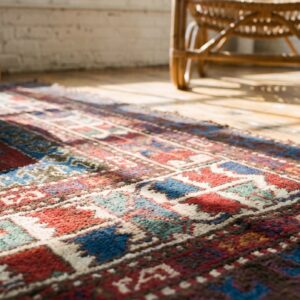 Antique Red Caucasian Tribal Geometric Medallion Kazak Rug (SKU 19575) - in-room detail