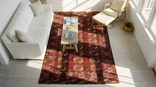 Antique red central asian turkman tekke allover geometric knotted rug 2 Antique red central asian turkman tekke allover geometric knotted rug (sku 23914) - styled overhead view