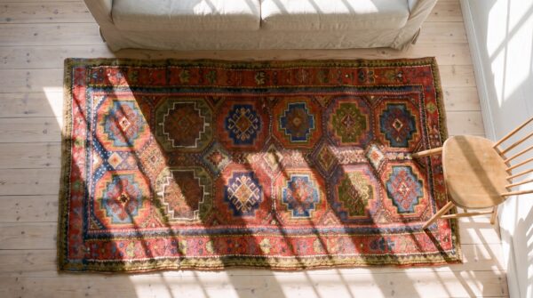 Antique red kurdish persian wool hand knotted hallway runner rug 2 Antique red kurdish persian wool hand knotted hallway runner rug (sku 23283) - styled overhead view