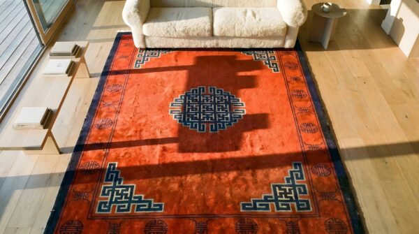 Antique red mongolian chinese medallion knotted rug (sku 23753) - styled overhead view