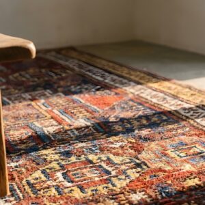 Antique Red Quchan - Kordi Persian Geometric Knotted Rug (SKU 23834) - in-room detail