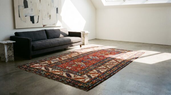 Red rustic antique allover tribal geometric pattern caucasus kazak wool pile rug 13 Red rustic antique allover tribal geometric pattern caucasus kazak wool pile rug (sku 19040) - room view