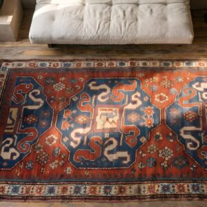 Red Antique Wool Pile Tribal Caucasian Kazak Rug (SKU 22194) - styled overhead view