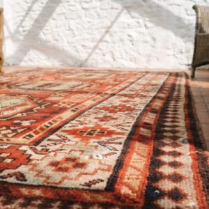 Red Antique Tribal Geometric Caucasian Karabagh Knotted Wool Pile Rug (SKU 18328) - in-room detail