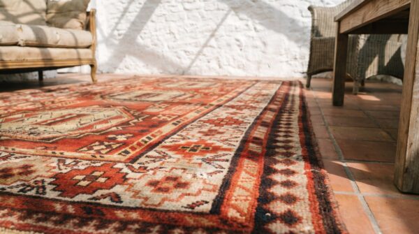 Red antique tribal geometric caucasian karabagh knotted wool pile rug 9 Red antique tribal geometric caucasian karabagh knotted wool pile rug (sku 18328) - in-room detail