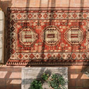 Red Antique Tribal Geometric Caucasian Karabagh Knotted Wool Pile Rug (SKU 18328) - styled overhead view