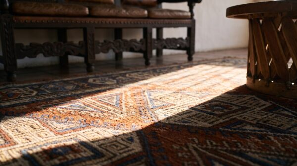 Red tribal geometric antique late 19th century caucasian soumak flatweave rug 9 Red tribal geometric antique late 19th century caucasian soumak flatweave rug (sku 24077) - in-room detail