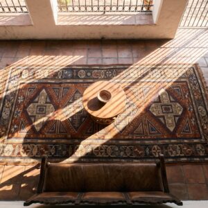 Red Tribal Geometric Antique Late 19th Century Caucasian Soumak Flatweave Rug (SKU 24077) - styled overhead view