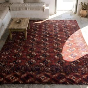 Red Antique Turkman Tekke Tribal Geometric Bokhara Design Rug (SKU 22769) - styled overhead view