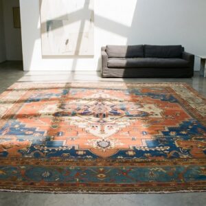 Antique Rustic Persian Heriz Serapi Coral Room Size Tribal Geometric Medallion Rug (SKU 19721) - room view