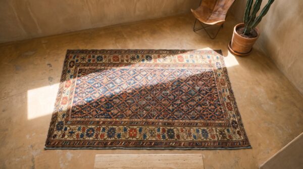 Rustic tribal geometric antique blue caucasian shirvan rug (sku 18174) - styled overhead view