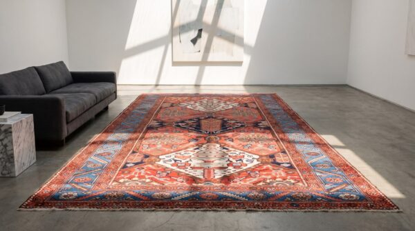 Rustic tribal geometric antique persian bakhtiari wool pile coral area rug 8 Rustic tribal geometric antique persian bakhtiari wool pile coral area rug (sku 21458) - room view