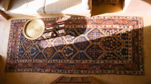 Rustic tribal shrub pattern antique persian afshar hallway runner rug (sku 21969) - styled overhead view
