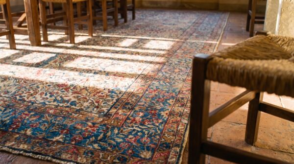 Antique s. E. Persian kirman gallery carpet 5'10"×17'10" beige field, blue border, circa 1920 10 Antique s. E. Persian kirman gallery carpet 5'10"×17'10" beige field, blue border, circa 1920 (sku 20936) - in-room detail