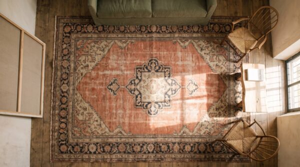 Antique senneh hallway runner wool coral rug (sku 20738) - styled overhead view