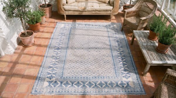 Small allover geometric white blue color antique cotton pile indian agra rug (sku 21341) - styled overhead view