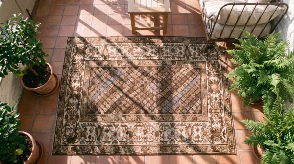 Small brown earth tone color antique tribal persian malayer rug (sku 21638) - styled overhead view