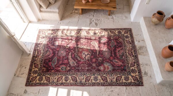 Small deep red antique 19th century indian agra rug 2 Small deep red antique 19th century indian agra rug (sku 21281) - styled overhead view