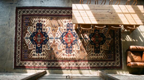 Small antique earth tone caucasian tribal geometric birds eagle kazak design seychour rug 2 Small antique earth tone caucasian tribal geometric birds eagle kazak design seychour rug (sku 18244) - styled overhead view